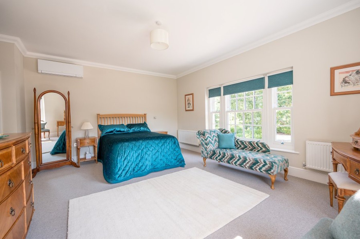 The principal bedroom suite at Monmouth House, with air conditioning